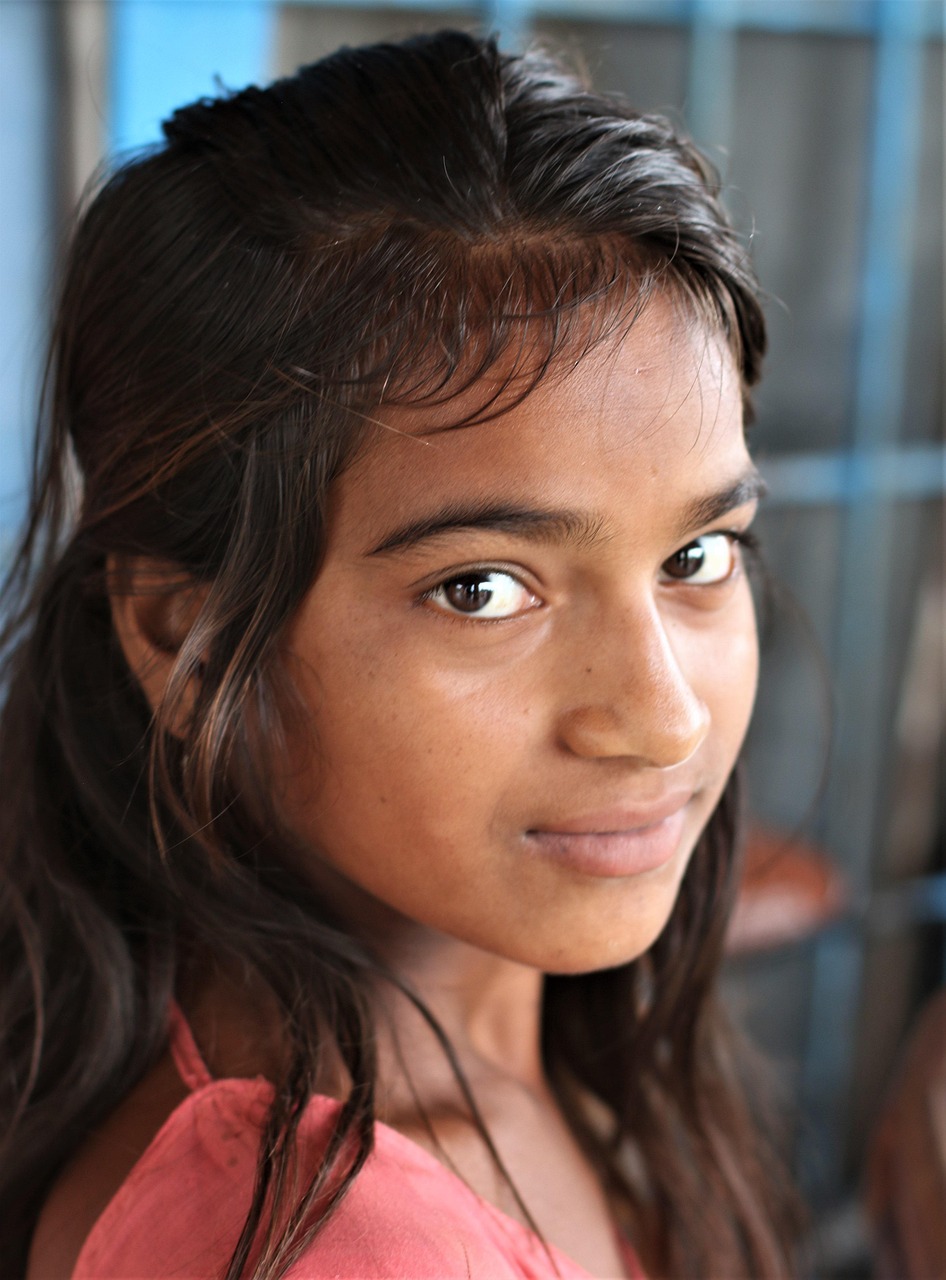 Close portrait of a young girl looking confidently toward the camera