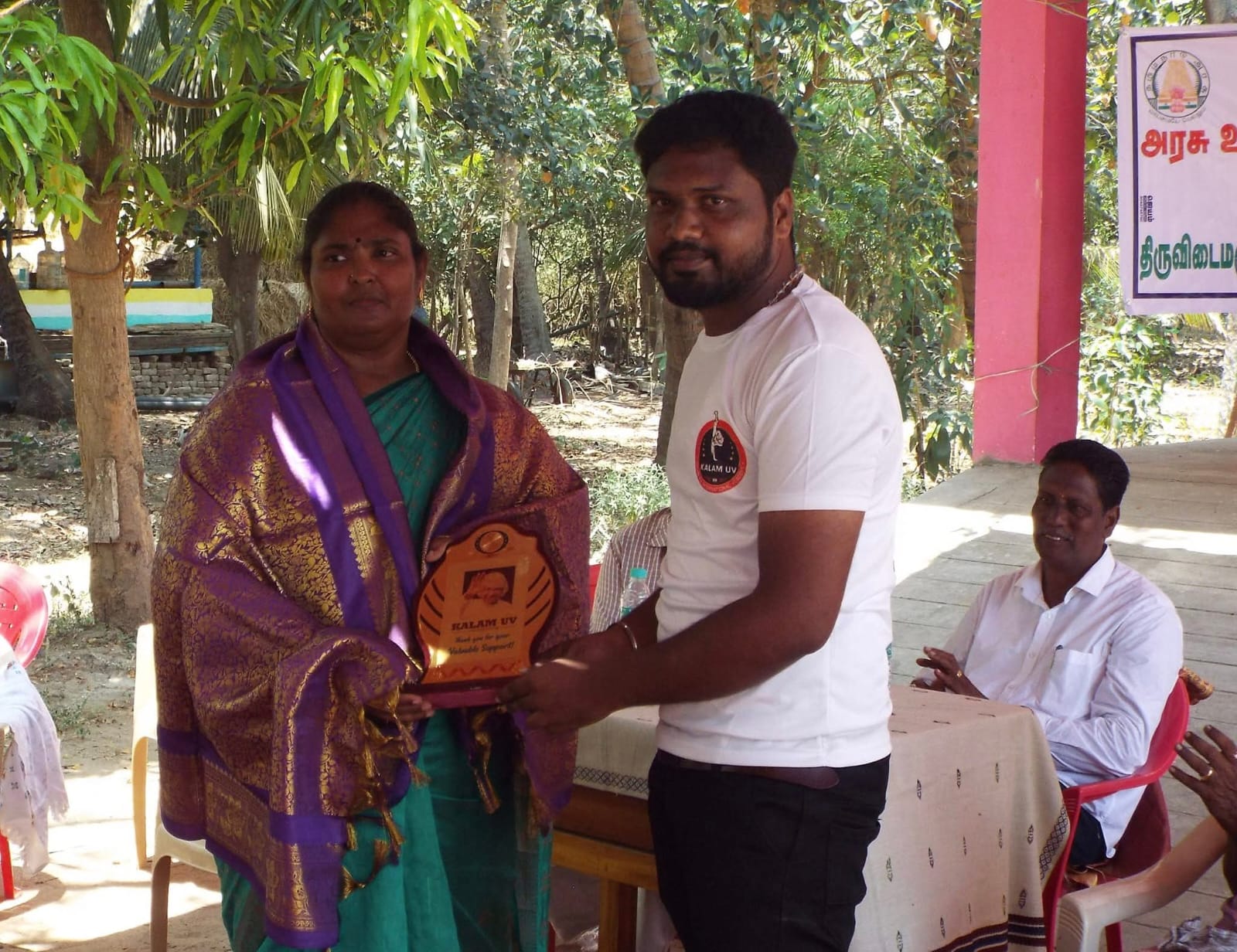 Community scholarship event with a student and local supporters